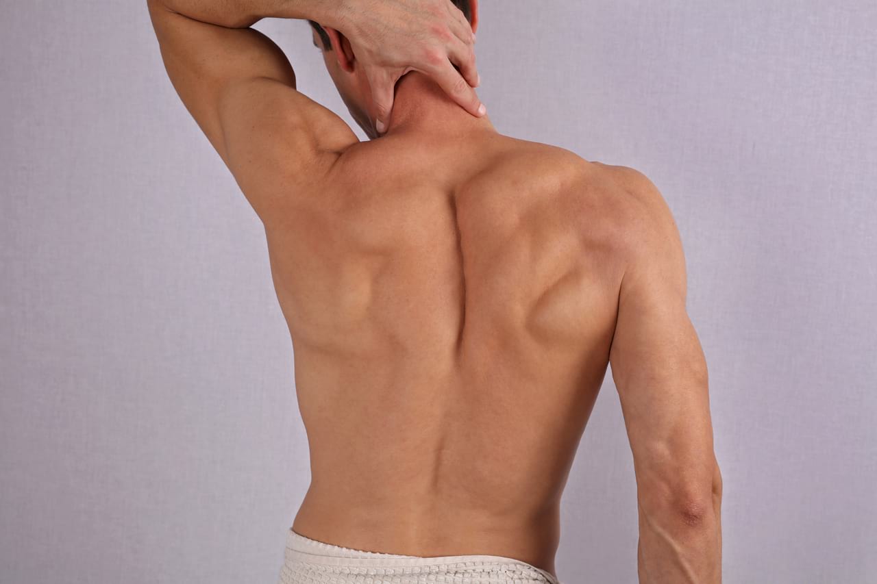 Image of a man's back, hairless
