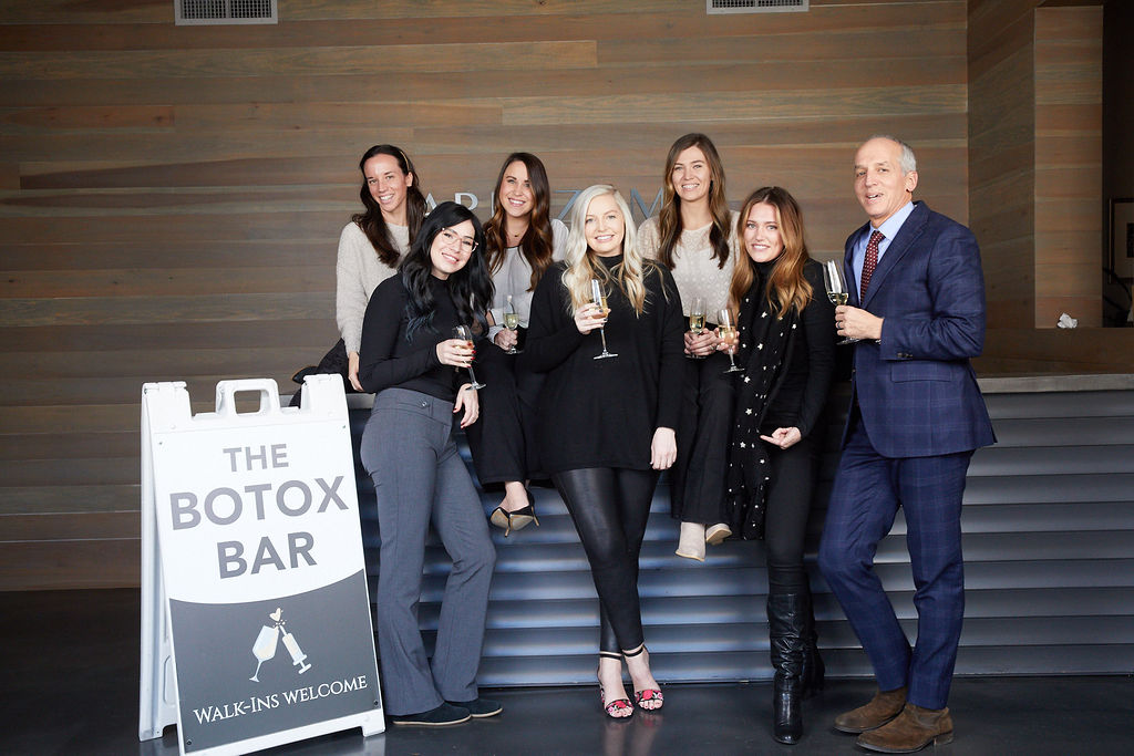 The Botox Bar sign "Walk-Ins Welcome". With the staff of Capizzi Med Spa Staff