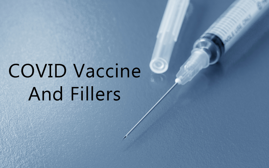 Uncapped syringe with the text of "COVID Vaccine and Fillers".