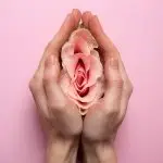Benefits of Labiaplasty: Woman holding rose in hands.